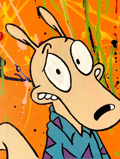 Rocko's Modern Orange Splatter Canvas Print featuring cartoon art and colorful splatters.