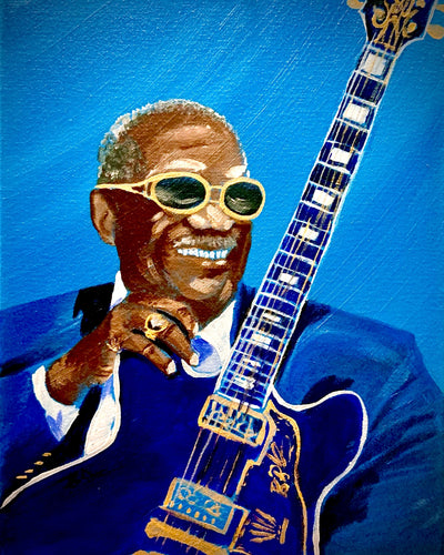 BB King canvas print capturing his iconic smile and guitar.